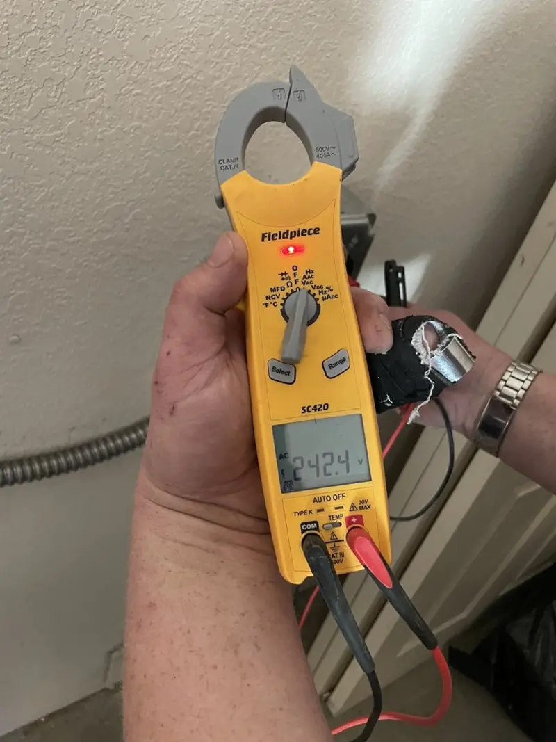 Voltage testing with clamp meter during Aluminum Wiring Replacement in Lakewood Ranch